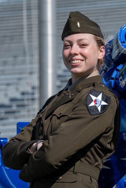 Katherine Profitt standing with arms crossed in Army uniform.