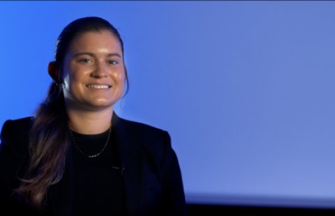 Portrait of young woman on blue background