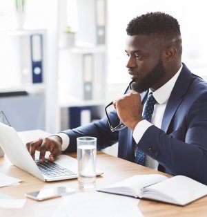 Executive works on laptop