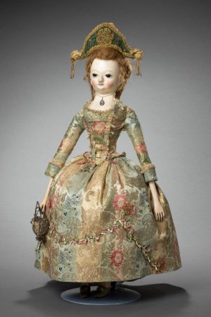 A wooden doll.