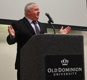Man speaking at podium