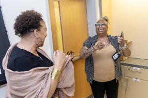 Kimberly Wilson presents Ebony Clark with the 2025 Staff Dream Fund Award.