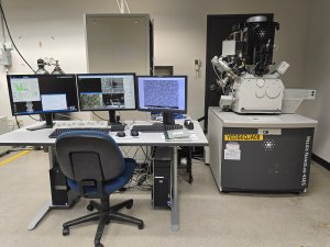 Desk and microscope FEI Helios NanoLab 450S DualBeam FIB/SEM