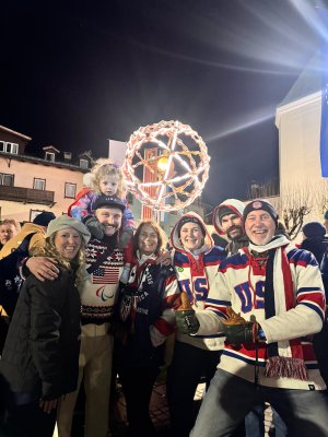 Tess Pleban and her family take a group picture at the Paralympics