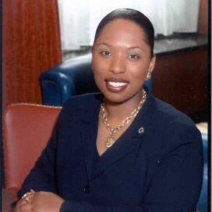 A smiling woman poses for a portrait.