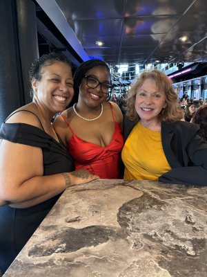 Photo of three women smiling.