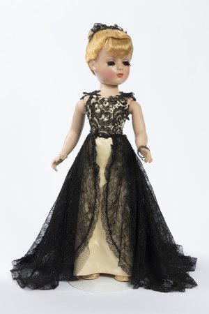 Photo of a doll in a black dress. 