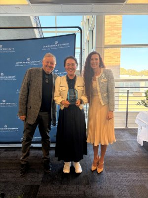 jinhee kim being given an award