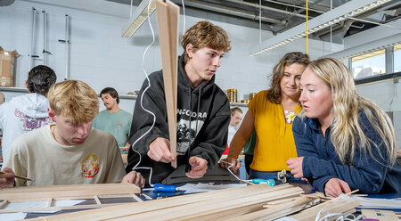 Civil engineering students work in a lab.