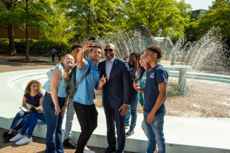 President Brian. O. Hemphill, Ph.D., takes a selfie with students.