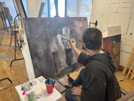 Student Colten Taylor works on a painting for “Envisioning Revolution: Virginians in Action