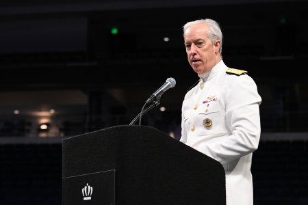 Admiral speaking at podium