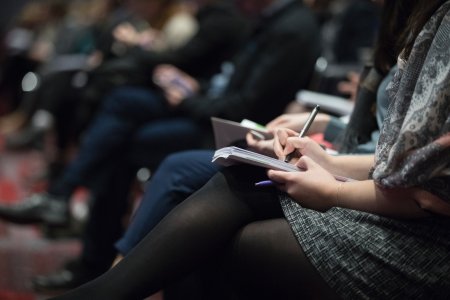 Woman sitting at conference