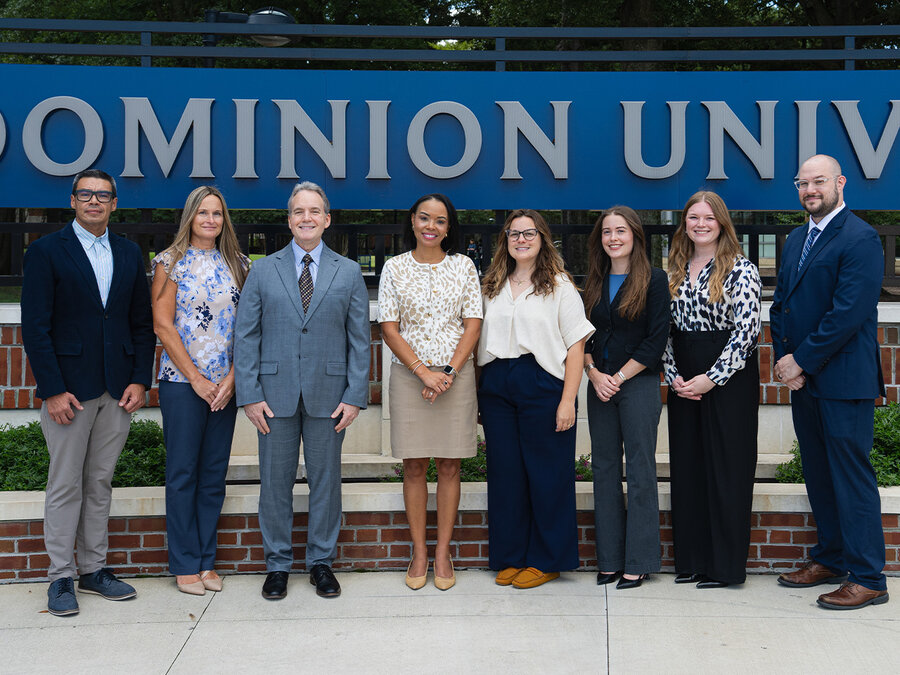 University Audit team in front of Old Dominion University sign. 