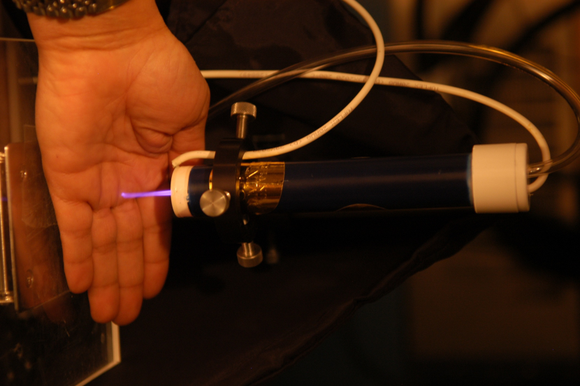 Plasma pencil touching hand