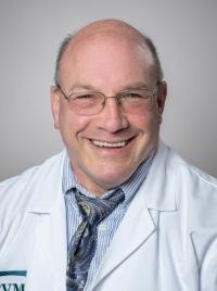 Headshot photo of Dr. Seth Berney smiling for the camera in 