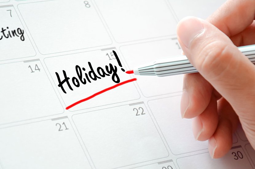 Holiday text on the calendar (or desk planner) underlined with red marker