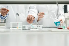 closeups of two pairs of researcher hands working side by si