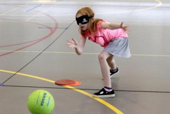 Photo of Sadie Tremel, 7, bowling during Mighty Monarchs.