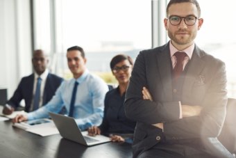 Professional sitting on desk