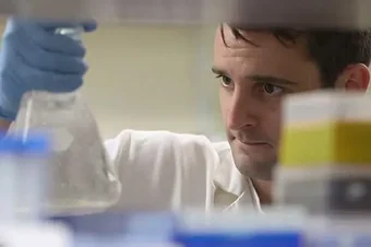 A student conducts research in an EVMS lab.