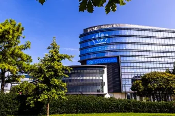 Waitzer hall is a multi-story building with mirrored walls a