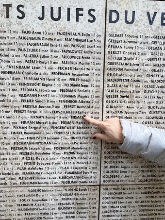 fact sheet with name in wall on stone