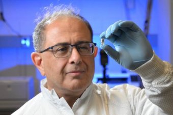 Ghodssi examining a vile.