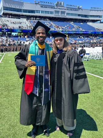 Ibrahima Wann and Dr. Elizabeth Black at Commencement.