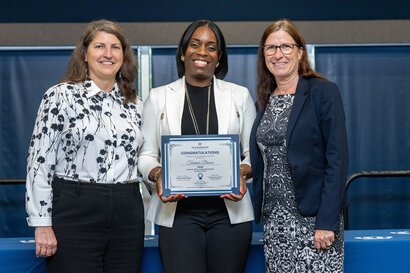 Terainer Brown receiving certificate of completion for Academic Affairs Leadership Academy. 