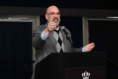 Provost Payne speaking at a microphone.