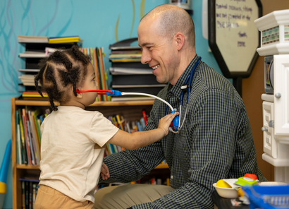 Physician meeting with child. 
