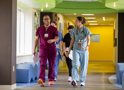 CHKD medical staff walking through hallway. 