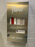 Sanitary products dispenser on bathroom wall
